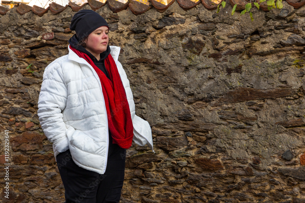 A plus-size woman strolling through the streets of a small European town.