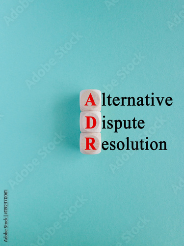 Obraz na płótnie Concept words ADM Alternative Dispute Resolution on wooden cubes. Beautiful blue background. Business concept. w salonie
