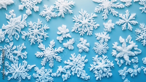 Wallpaper Mural Fluffy White Snowflakes on Light Blue Background, Winter Festive Pattern. Torontodigital.ca