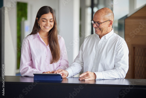 Wallpaper Mural Happy coworkers using tablet PC at office Torontodigital.ca