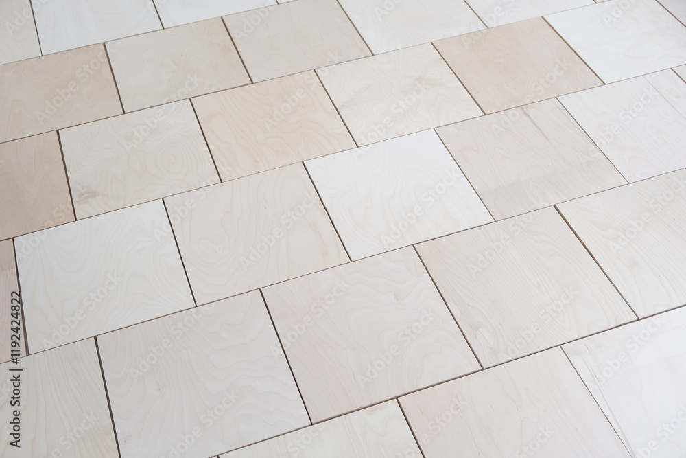 Naklejka premium Plywood sheets on the floor. Professional plywood laying with gaps and displacement. Base for floor coverings, parquet or laminate. Apartment renovation
