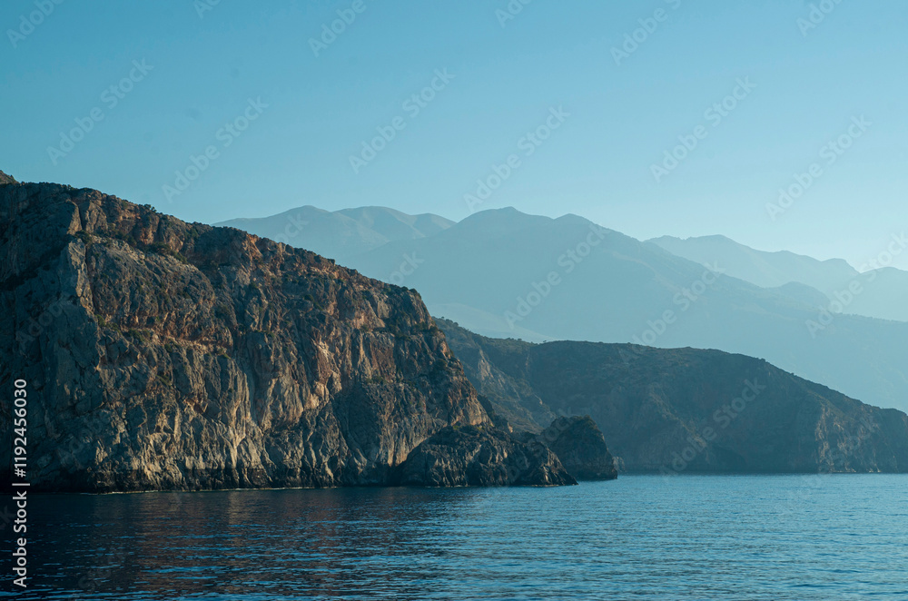 Wild rocky shore of southern Crete on Libyan sea in early morning, Greece Wild rocky shore of southern Crete on Libyan sea in early morning, Greece