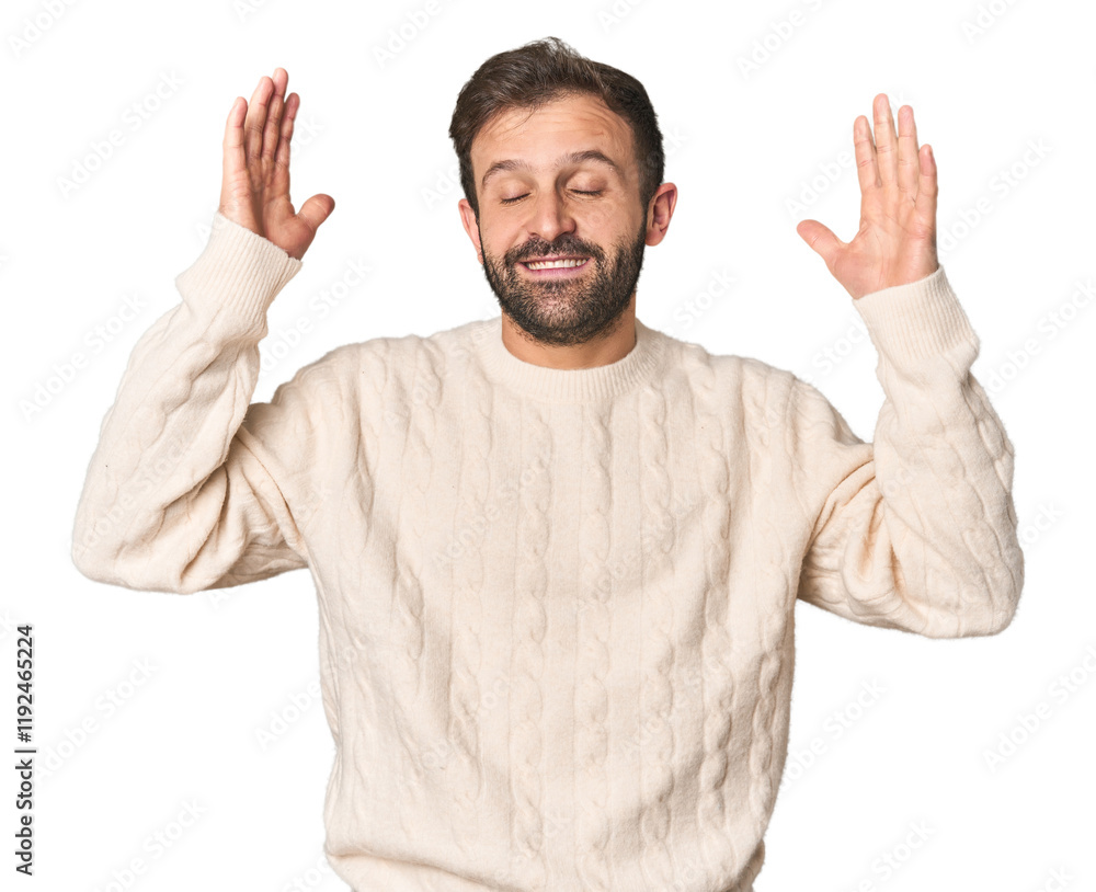 Naklejka premium Studio portrait of young Hispanic male joyful laughing a lot. Happiness concept.