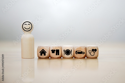 Fotografie wooden cube with icons of food, Clothing, housing, medical bag, four basic human needs concepts