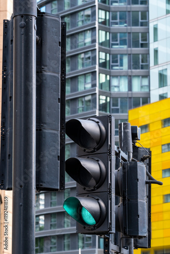 This image features a clear display of traffic signals showing a green light, symbolizing movement, progress, and the flow of life in a vibrant urban environment in London UK photo