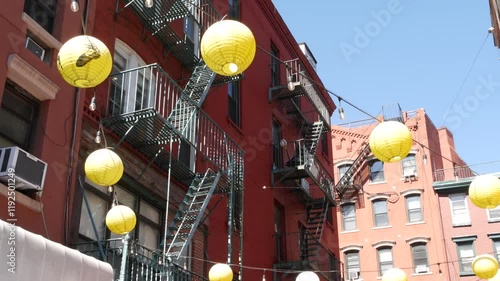 New York City, United States. Manhattan Chinatown Doyers street, chinese ethnic district building architecture, USA. Brick houses, round paper lanterns, little China town. American fire escape ladder.