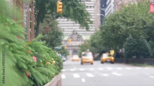 New York City Park Avenue. Grand Central Terminal railway station on 42 street. Manhattan Midtown. Yellow taxi cab in NYC, USA. American urban road car traffic, transport in United States. Defocused.