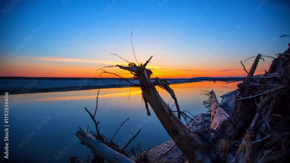 Time Lapse Shot Of Reflection Of Orange Clouds In Tranquil River During Sunset - Seward, Alaska Time Lapse Shot Of Reflection Of Orange Clouds In Tranquil River During Sunset - Seward, Alaska