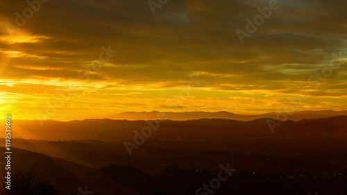 Wallpaper Mural Aerial Time Lapse Lockdown Shot Of Silhouette Mountain Range Under Orange Dramatic Clouds At Sunset - Honolulu, Hawaii Torontodigital.ca