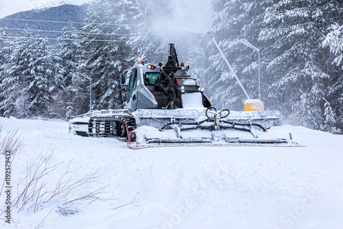 Snow groomer ratrack machine, ski slope photo