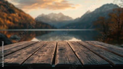 Scenic empty wooden table overlooking a tranquil lake and mountains at sunset ideal for product display and promotional content