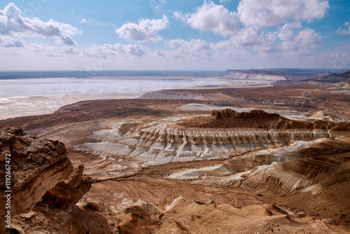 On the Ustyurt Plateau. Here, the Ustyurt Cliff steeply breaks by a cascade of clay-limestone and chalk steps, at the bottom of which lies a vast salt marsh, called in this region, Tuzbair.