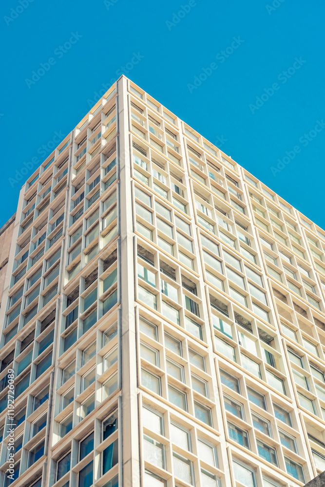Modern high-rise office building against a clear blue sky in Marseille, France Modern high-rise office building against a clear blue sky in Marseille, France