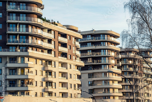 Modern residential buildings with balconies in an urban area at sunset, Krakow, Poland