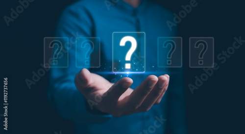 Obraz na płótnie Hands holding FAQ question mark sign. Question Mark and Problem-Solving Concept. Finding answers to business FAQs. Creativity and ideas, asked questions and answers. Brainstorming and problem-solving. w salonie