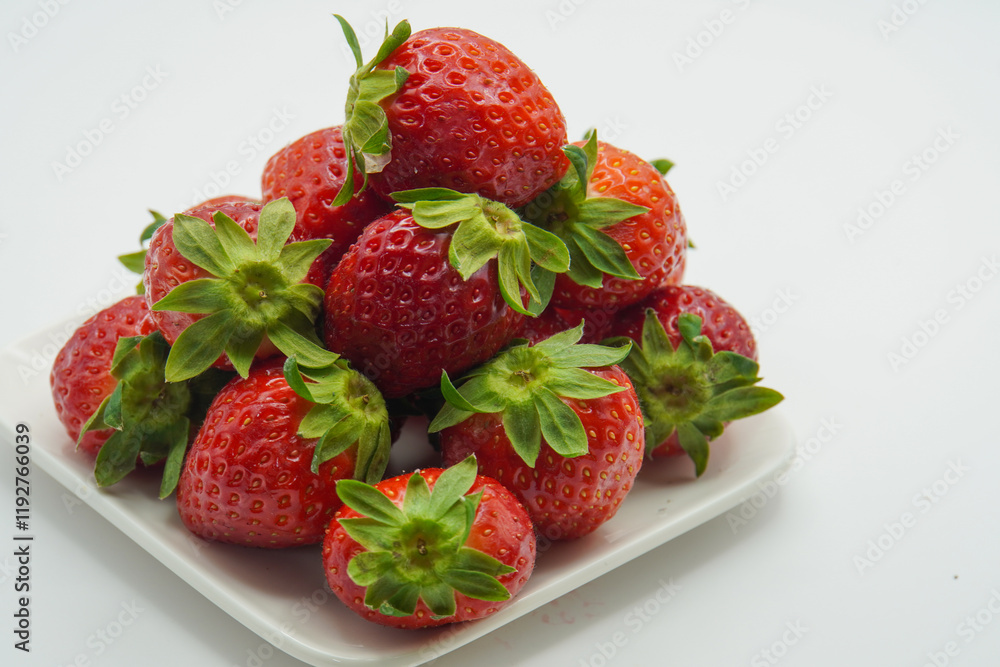 pile of fresh strawberries on a plate pile of fresh strawberries on a plate