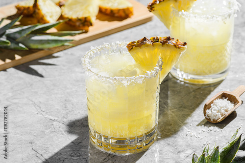 the pina colada cocktail is decorated with pineapple and coconut shavings photo