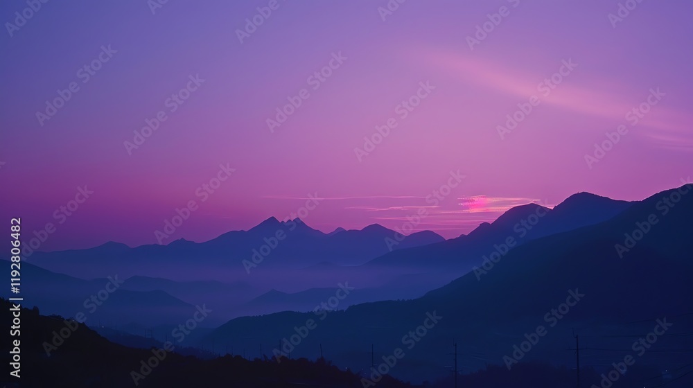 Fototapeta premium A beautiful sunset over a range of mountains.