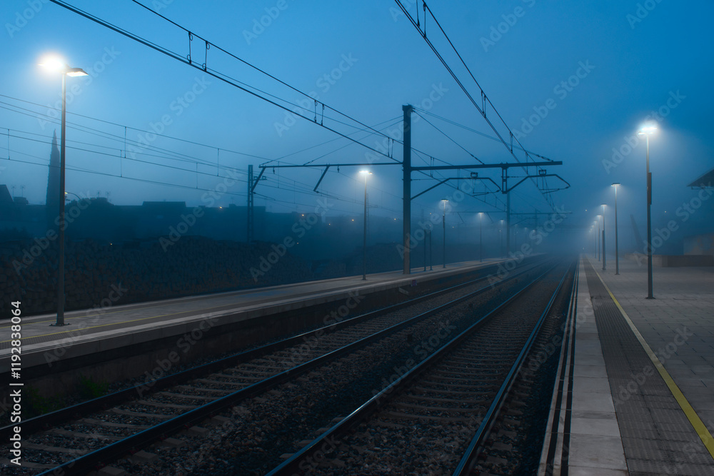 Foggy evening at an empty railway station Foggy evening at an empty railway station