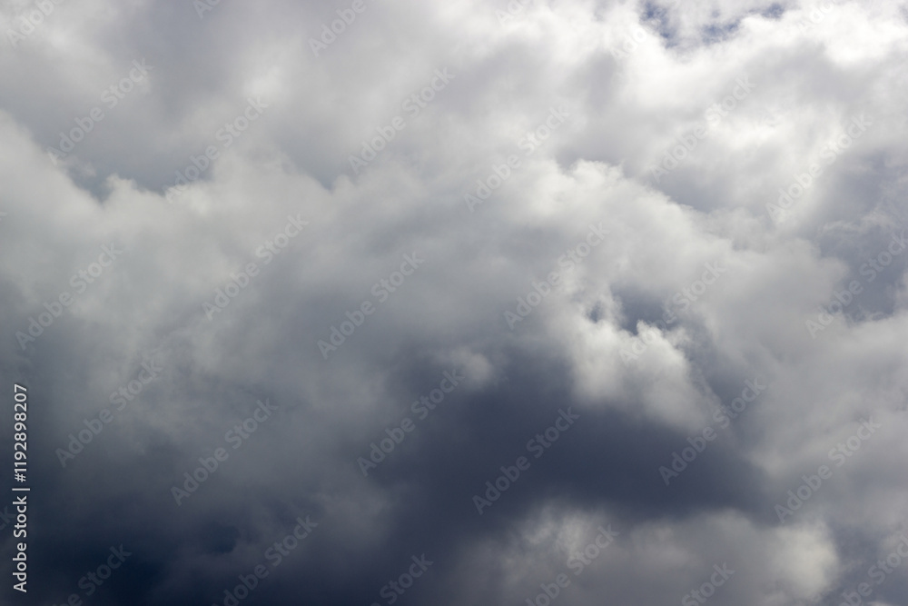 Overcast sky with dense, dramatic gray clouds creating a moody and atmospheric scene with soft light and textured formations Overcast sky with dense, dramatic gray clouds creating a moody and atmospheric scene with soft light and textured formations