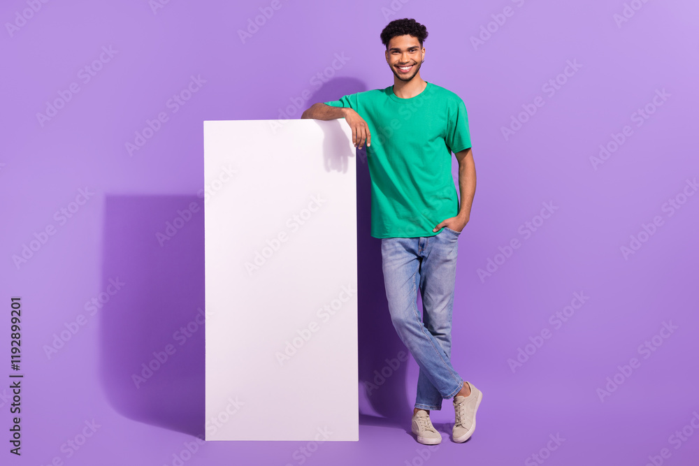 Full length body cadre of young satisfied man confident recommend samsung high quality screen no glares isolated on purple color background Full length body cadre of young satisfied man confident recommend samsung high quality screen no glares isolated on purple color background