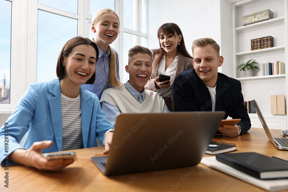 Group of people using different gadgets at wooden table in office. Modern technology Group of people using different gadgets at wooden table in office. Modern technology