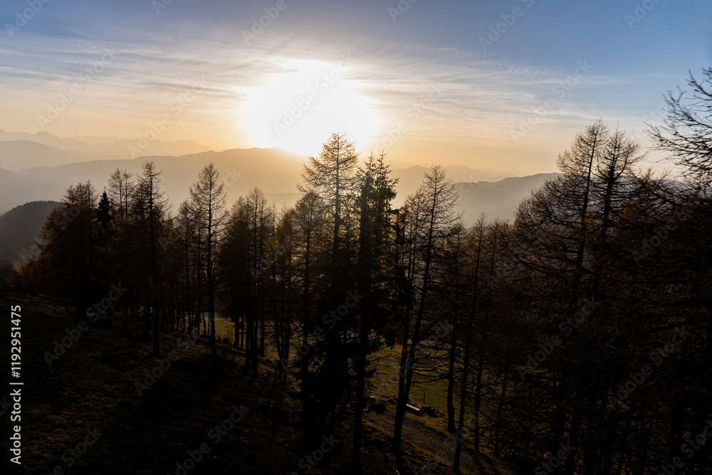 Obraz premium The top of the Austrian mountain Gerlitzen in the Carinthian Alps in autumn at sunset with a view of the forest