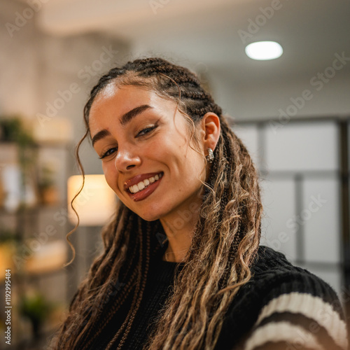 Fotografie beautiful smiling young woman take a self portrait and pose at home