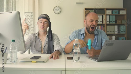 Business people suffering from the heat in the office