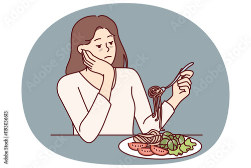 Woman suffering from anorexia is sad due to lack of appetite and sits at table with spaghetti and salad in plate. Skinny girl with sickly appearance suffers from anorexia after wrong diet