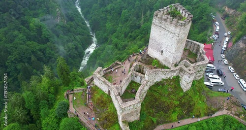 4K UHD aerial drone footage of the historic Zilkale castle surrounded by a misty forest in Çamlıhemşin. A breathtaking view of nature, history, and atmospheric beauty. photo