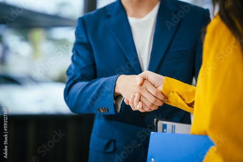 A businessman and businesswoman shake hands during a meeting at the office,signifying collaboration.They discuss strategies, agreements,opportunities to drive business growth strengthen professional photo