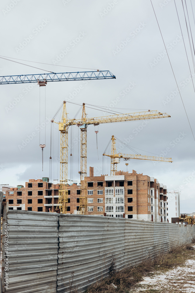 Construction site with tower cranes. Construction of multi-storey buildings. Construction site with tower cranes. Construction of multi-storey buildings.