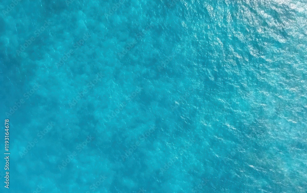 Aerial view of clear turquoise ocean water with gentle waves, showcasing the serenity and beauty of nature. Aerial view of clear turquoise ocean water with gentle waves, showcasing the serenity and beauty of nature.
