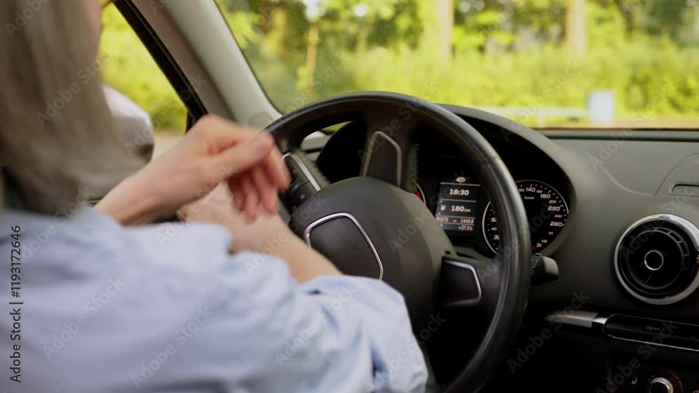 Close up back view unrecognizable Caucasian elderly woman senior gray haired lady car driver female hands holding steering wheel dashboard driving automobile steer machine ride turning inside vehicle Close up back view unrecognizable Caucasian elderly woman senior gray haired lady car driver female hands holding steering wheel dashboard driving automobile steer machine ride turning inside vehicle