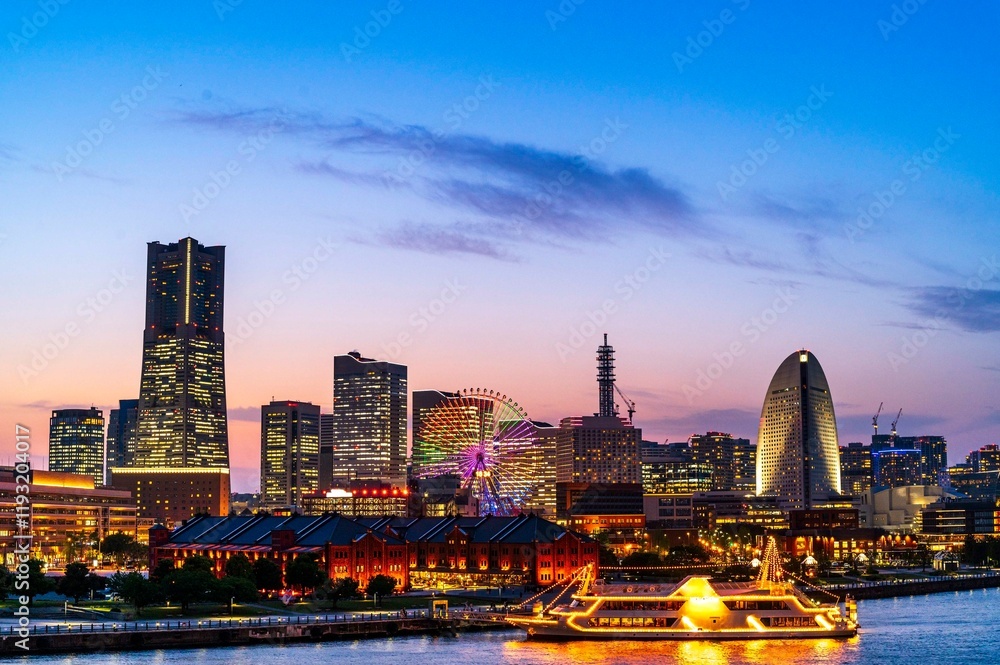 sweet sunset winter and light illumination from Cityscape of Yokohama city, Skyline and office building and downtown in Minatomirai Area, Yokohama city port, Kanagawa, Japan