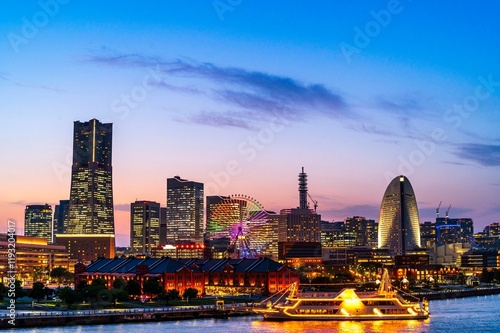 Obraz na płótnie sweet sunset winter and light illumination from Cityscape of Yokohama city, Skyline and office building and downtown in Minatomirai Area, Yokohama city port, Kanagawa, Japan w salonie
