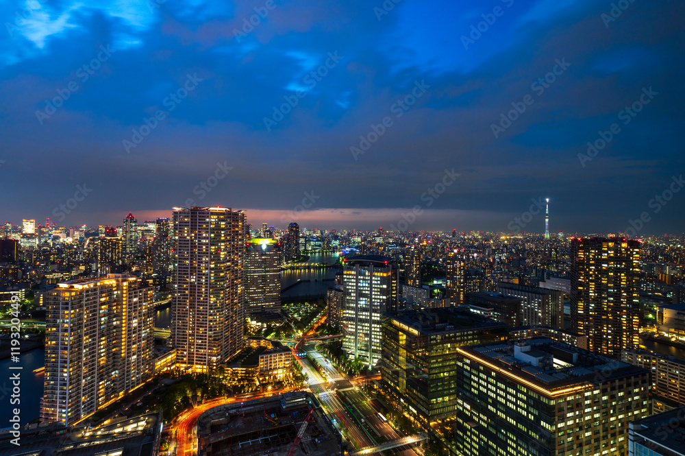 Nightlight Cityscape of Tokyo, city aerial skyscraper view of office building and downtown and street of minato in tokyo with twilight sky background. Japan, Asia