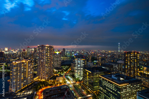 Obraz na płótnie Nightlight Cityscape of Tokyo, city aerial skyscraper view of office building and downtown and street of minato in tokyo with twilight sky background. Japan, Asia w salonie