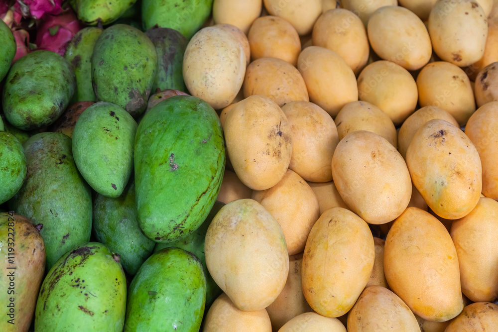 Lots of different ripe fruits on the market in Asia. Fruity multicolored background. Lots of different ripe fruits on the market in Asia. Fruity multicolored background.