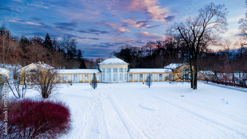 Small colonnade in Marianske Lazne (Marienbad) - snow winter in spa park. Spa architecture - evening colonnade of cold mineral water spring Ferdinand - Czech Republic, Europe photo