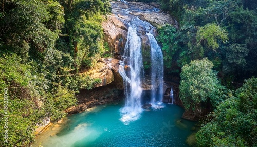 Wallpaper Mural Generated image Aerial shot of the Ravana Falls cascading into a serene pool surrounded by jungle Torontodigital.ca