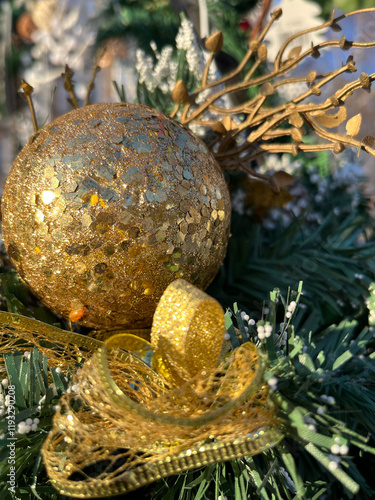 Golden Christmas ball and bow on street decoration