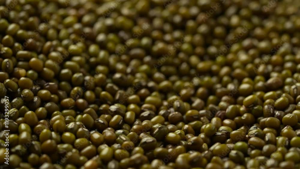 Macro video of mung beans kept on rotating surface. Bunch of moong beans. Macro video of mung beans kept on rotating surface. Bunch of moong beans.