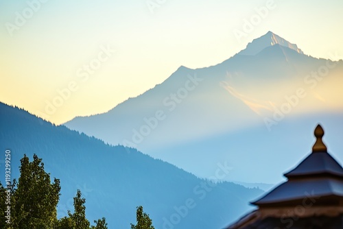 serene view of yogi in warrior ii pose their focus steady with mountain range softly blurred behind photo