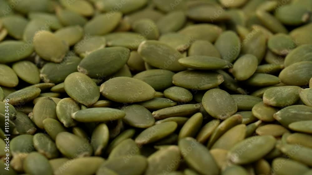 Macro video of pumpkin seeds on rotating disc. Close up of bunch of pumpkin seeds. Macro video of pumpkin seeds on rotating disc. Close up of bunch of pumpkin seeds.