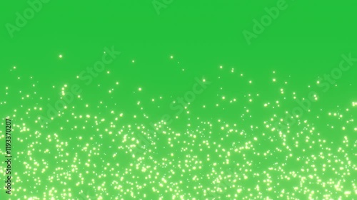 Gold particles glowing sparkles in seamless loop overlay on green screen chroma key background animation 4k visual effect. Elegant festive looped animation. Glitter bokeh visual effect.