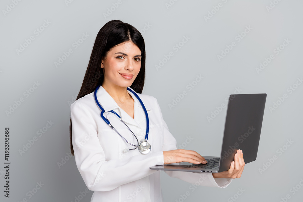 Young female healthcare professional using a laptop for work with confidence Young female healthcare professional using a laptop for work with confidence