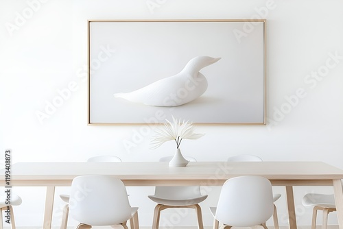 Minimalist dining area with a wooden table, white chairs, a simple vase with abstract leaves, and a framed artwork of a white bird on a clean white wall. photo