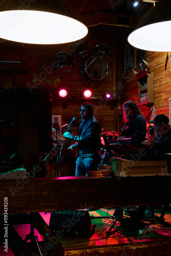 Energetic heavy metal performance at an intimate venue during the late night